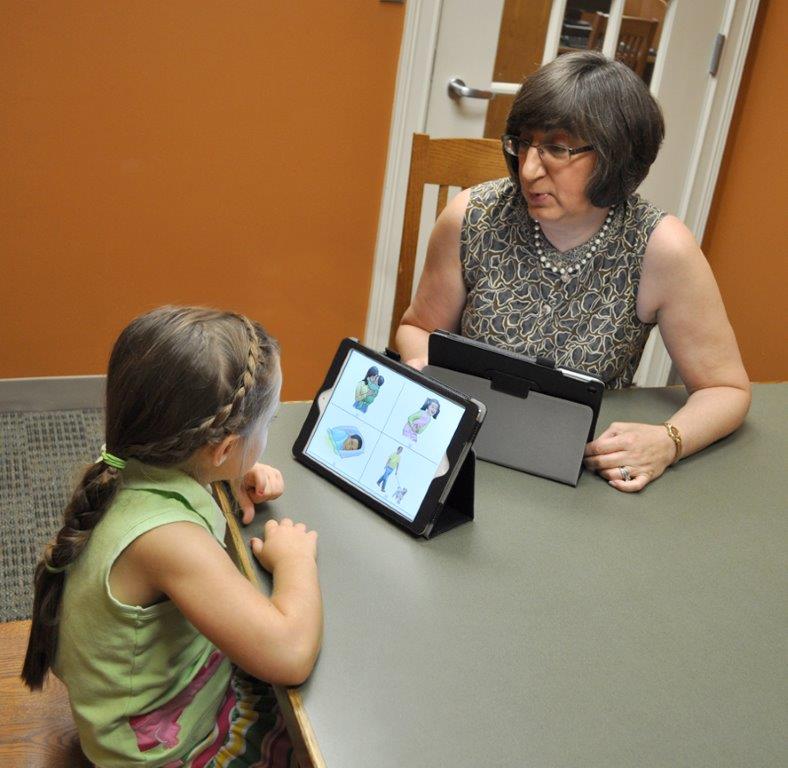 Photo of Loretta teaching a girl